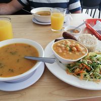 Soup, and the main dish with chickpea curry, rice, salad and quibes at Semillas de Albahaca in Tunja