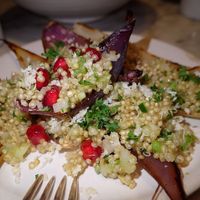 Sauted eschalot with quinoa, grated coconut, pomegranate pies and herbs. This was one of the 3 starters. at Graanmarkt 13 in Antwerpen