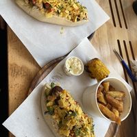 vegan sausage in ‚dwaze dienaar’ half roasted corn and fries w vegan mayo   at Dogma in Utrecht