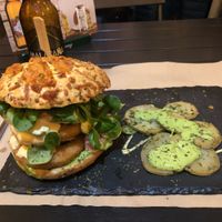 The bun has cheese on it but it can be ordered without.  at Sanissimo - Principe Pio in Madrid