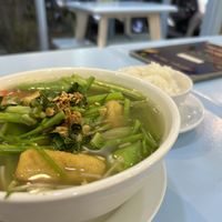 Soup with little bowl of extra rice  at Vegan Family Restaurant in Ho Chi Minh City