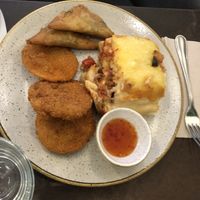 Lasagna, samosas, and sweet potato tempura  at Nordvegan in Oslo