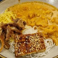 Curry with fried mushrooms, noodles & tofu at Nordvegan in Oslo