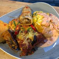 Lasagna, enchiladas, potatoes and spring roll. So good. So much food!!  at Nordvegan in Oslo