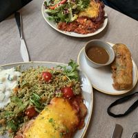 Mains with salad and topping and a summer roll on the side at Nordvegan in Oslo