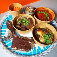 Delivery: Medaillon de steak + gratin dauphinois + lasagna + pickles + opéra + boudin noir at Le Faitout Vegan in Paris