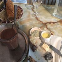 To die for cheese plate, baguette and chocolat chaud. at Le Faitout Vegan in Paris