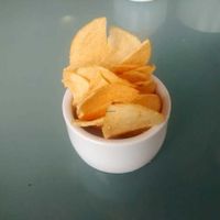 Small ramekin of chips on the side at Musicker in Isle Of Bute