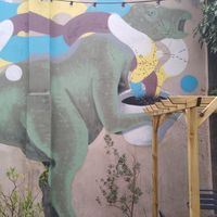 Iguanodon with a coffee. at Full Circle - Zuid in Ghent