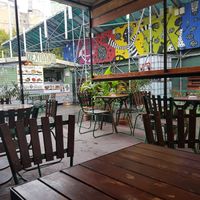 Outdoor covered seating area at Las Vegan's - Kazinczy Trailer in Budapest