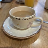 Breakfast tea with oat milk, and a super cute cup 😍  at Holy Cow in Edinburgh