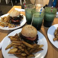 “Fish” burger and BBQ burger with green smoothies  at Holy Cow in Edinburgh