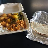 Three Vegetables (Potatoes + green beens, chana masala, and aloo mutter) with rice and vegan naan  at Flavors of India in Columbus