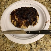 This is the chocolate chip bun that cost $17.99. The normal size steak knife is there for scale. 🤬😳😔 at Joseph's Organic Bakery in Miami
