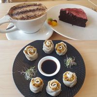 Almond milk mocha, cake, and dumplings.  at The Origin in Christchurch