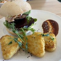 Burger with hash browns   at The Origin in Christchurch