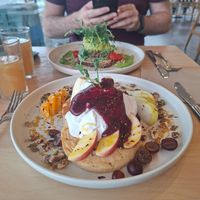 Pancakes. And avo toast in background at The Origin in Christchurch