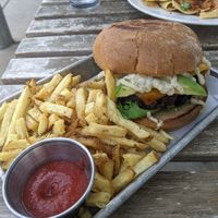Citizen burger with avocado and cheese on it at Citizen Eatery in Austin