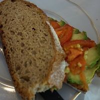 Tosti (abocado & tomatoes) You get to choose the stuffing, as many as you wish.  at Quinta Verde in The Hague