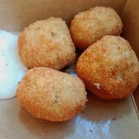 Potatoes fritters and sauce at Season Square in Paris