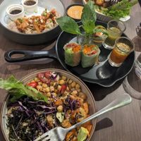 Kimchi dumplings, sweet potato quinoa bowl, b*con spring rolls, cauliflower wings at Veganerie - Ratchathewi in Bangkok