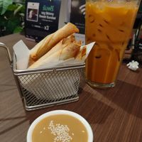 Cheesy spinach sticks are awesome 👍🏽👍🏽 milky Thai tea😋 at Veganerie - Ratchathewi in Bangkok