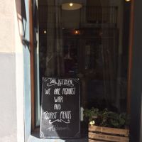 Sign in Soul Kitchen window:
We are against war and tourist menus! at Soul Kitchen in Avila