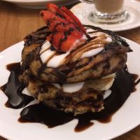 Blueberry breakfast pancakes with chocolate sauce 😋 at Ahimsa The Vegan Cafe in North West London