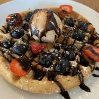 Waffle, fruit & ice cream   at Ahimsa The Vegan Cafe in North West London