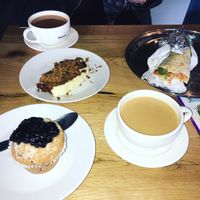 blueberry muffins, carrot cake & a jerk quorn chicken wrap with tea! at Ahimsa The Vegan Cafe in North West London