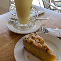 Polenta cake and turmeric latte at Ahimsa The Vegan Cafe in North West London