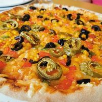Half and half pizza at Ahimsa The Vegan Cafe in North West London