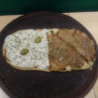 Pizza meio Muzzanut meio Cabolleta at Pizza Vegana - San Telmo  in Buenos Aires