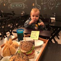 Kael comemorando seu primeiro ano de vida com muita comida vegana  at Ahimsa Burgers in Florianopolis