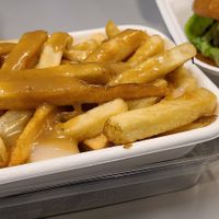 Poutine. Not enough cheese but the mushroom sauce was great. at LOV - McGill in Montreal