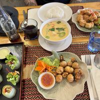 Fresh spring rolls, money bags, red curry and spicy califlower wings  at Vegan Heaven in Chiang Mai