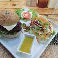burger with 'chz and salad at Vegan Heaven in Chiang Mai