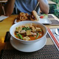 Tom yum with noodles and hot dog with onion rings at Vegan Heaven in Chiang Mai