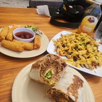 Burrito, spring rolls, cheese fries at Pura Vegan in Tamarindo
