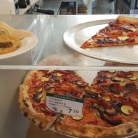 Fresh hot pizza waiting in the cabinet. at Nicoletta's Cake Boutique in Wellington