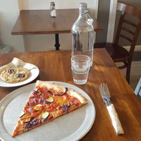 A slice and a cookie biscuit for a quick tasty lunch. at Nicoletta's Cake Boutique in Wellington