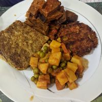 seitan, zucchini fritter and two other things at Vegan Istanbul in Istanbul