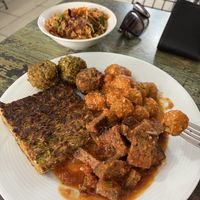 Bulgur salad, zucchini patty, Seiten, falafel, and some Turkish balls of some sort in sauce.   at Vegan Istanbul in Istanbul