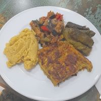 Aubergine, dolmades, Hummus, and zucchini patty at Vegan Istanbul in Istanbul