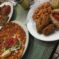 Variety of dishes accompanied with turkish pizza  at Vegan Istanbul in Istanbul