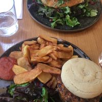 Front: vegetable burger with hand-cut fries & homemade ketchup; back: savoury pancakes with avocado cream and poached egg (can be ordered without egg) at Judy in Paris