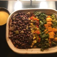 Brown rice and quinoa bowl with red coconut curry sauce at PlantPure Cafe in Philadelphia