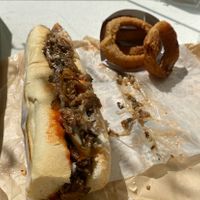 Philly Cheesesteak and Onion Rings  at HipCityVeg - Broad St in Philadelphia