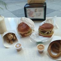 Pass the plants! A vegan feast! Left to right: caramel apple shake, chicken tenders, Ziggy burger, crispy chicken sandwich, onion rings. And the delicious dipping sauce of course! at HipCityVeg - Broad St in Philadelphia