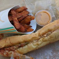 Philly cheese steak but with chick'n fajita and sweet potato fries with Sriracha aioli at HipCityVeg - Broad St in Philadelphia